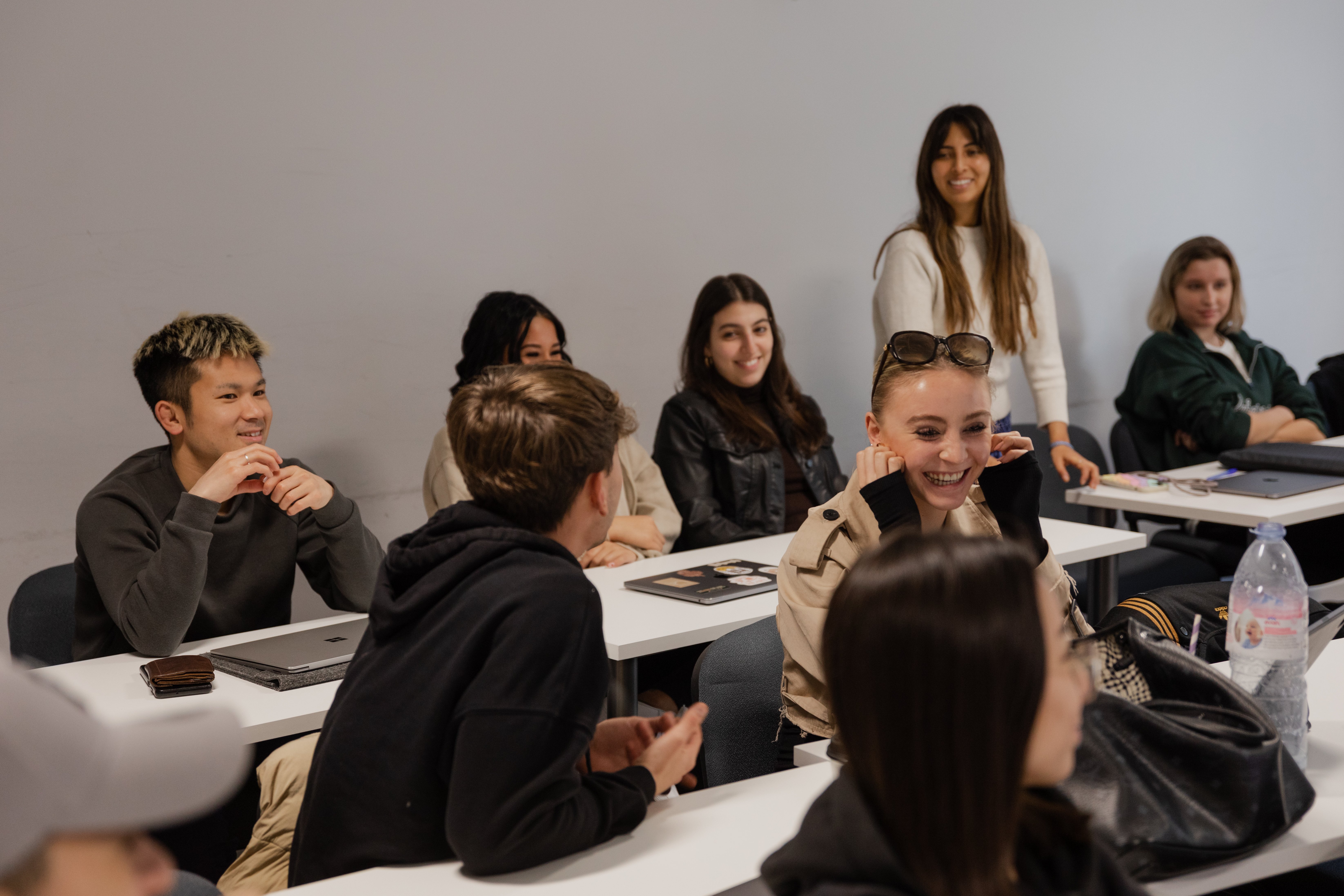 Students laughing together in a GBSB Global classroom